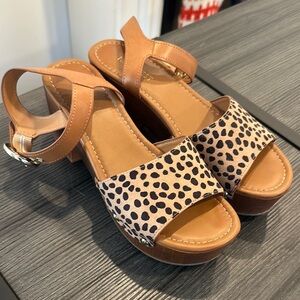 Tan platform sandals with ankle strap and leopard print design